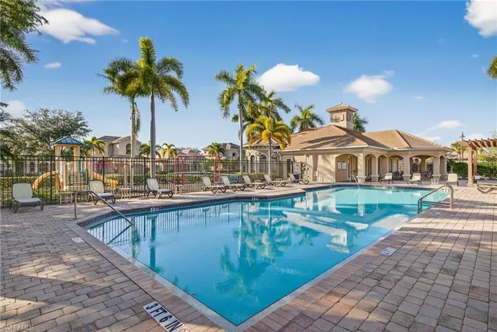 Clubhouse pool, spa and sundeck within amenity-rich Naples gated community of Andalucia