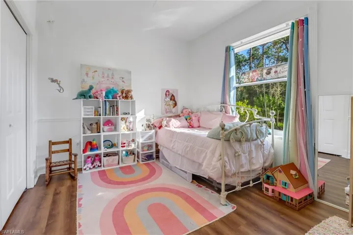 Bedroom featuring a closet and wood finished floors