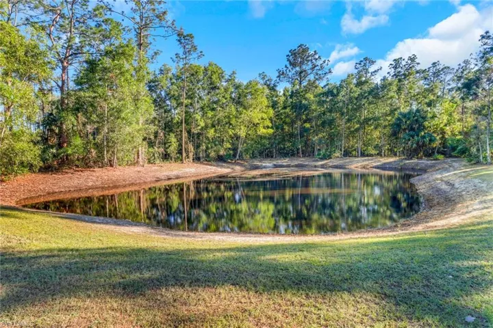 Property view of water with a forest view