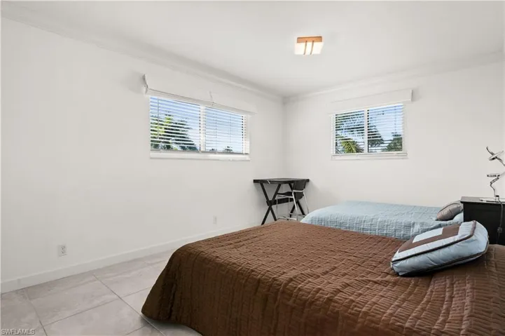 Bedroom featuring ornamental molding
