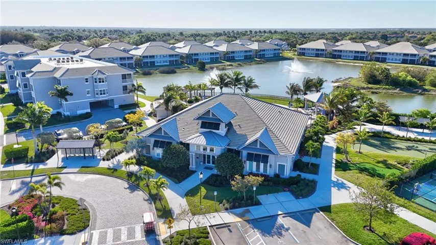 Aerial perspective of suburban area with a nearby body of water