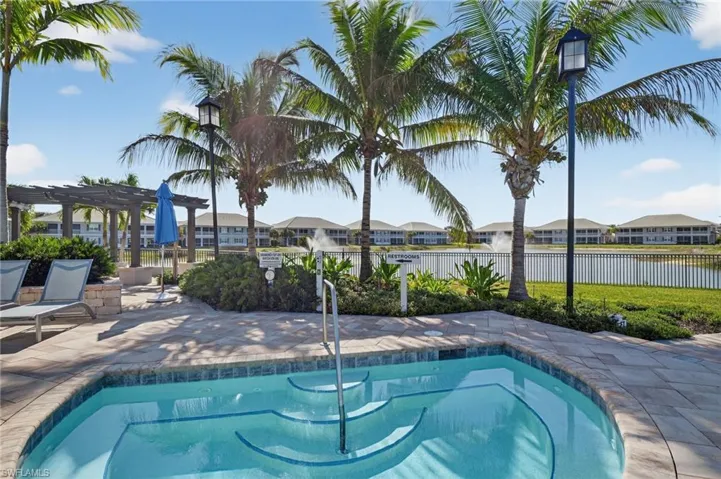 View of pool with patio surround, a residential view, a pergola, and a swimming pool