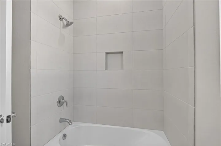 Full bathroom with bathing tub / shower combination