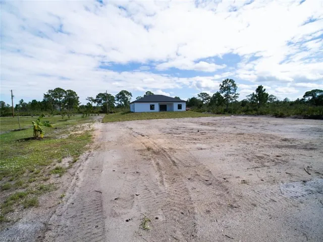View of back of home featuring a view of rural / pastoral area