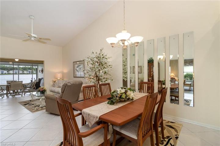 Open dining area and living room with a view of the lake