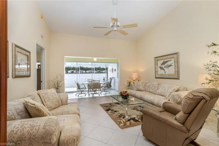 with volume ceiling and lake view