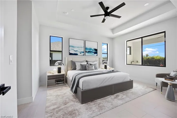 Virtual Stage-Bedroom with multiple windows, a raised ceiling, and baseboards