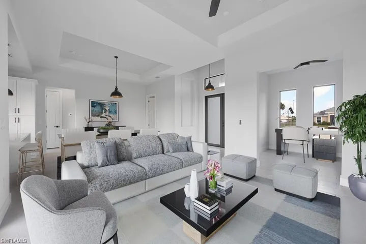 Virtual Stage-Living room with a tray ceiling and a ceiling fan