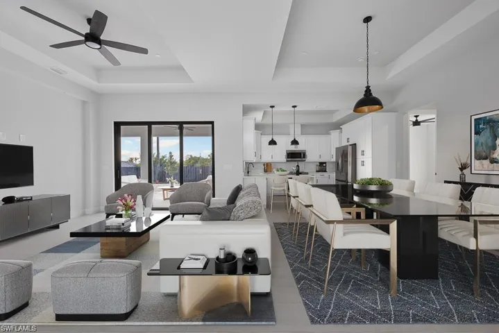 Virtual Stage-Living room featuring a tray ceiling and ceiling fan