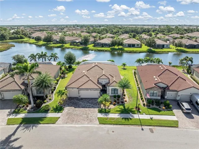 Aerial perspective of suburban area with a nearby body of water