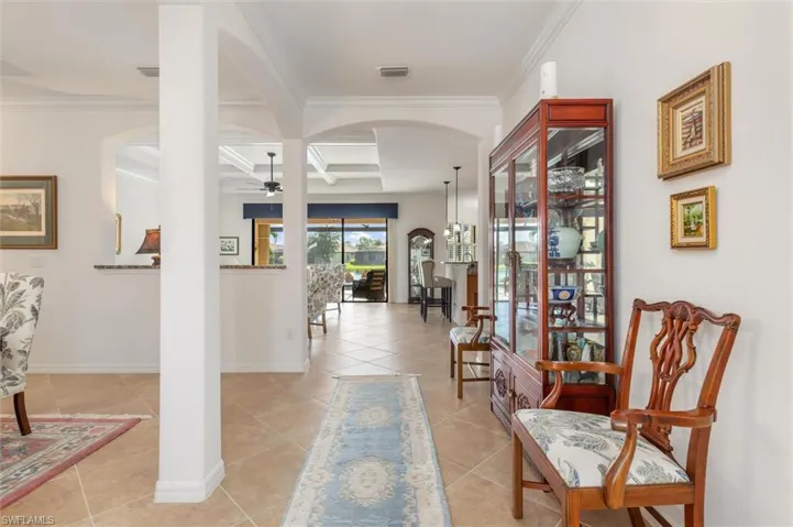Entrance to home provides views of pool and lake