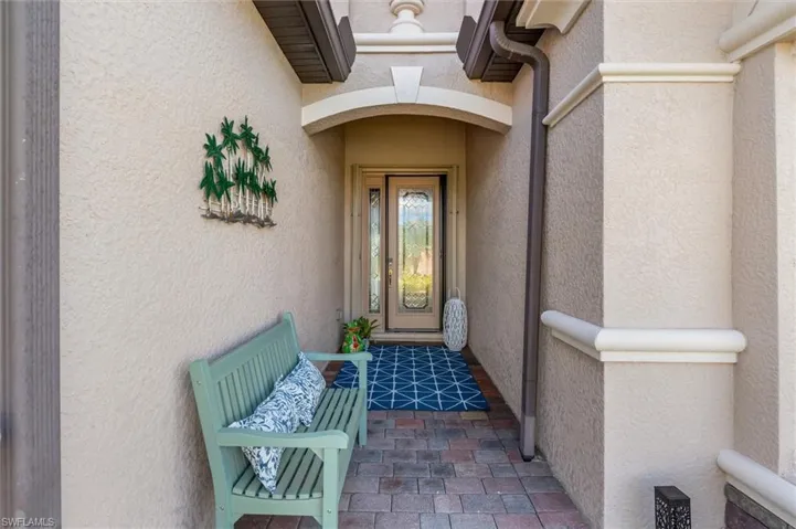 Entrance to property featuring stucco siding