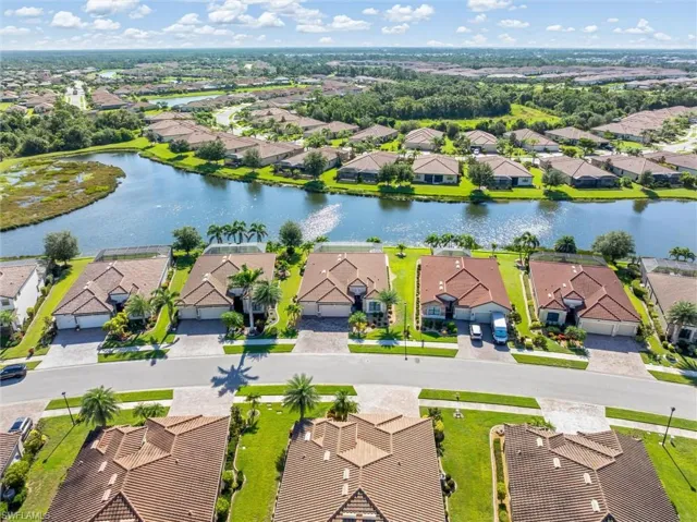 Aerial view of residential area featuring a large body of water