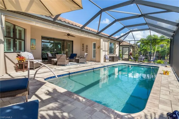 Swimming pool featuring a patio, a lanai, outdoor lounge area, a ceiling fan, and a sunroom