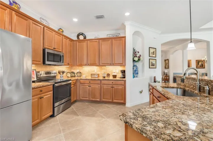 Custom backsplash and lighting in kitchen