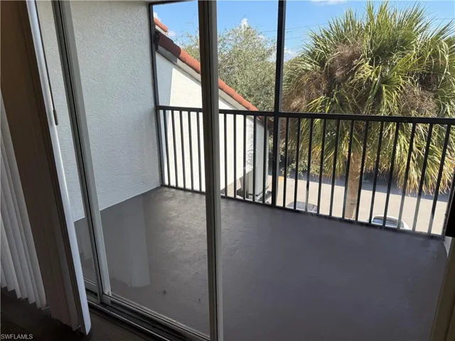 Balcony featuring a sunroom