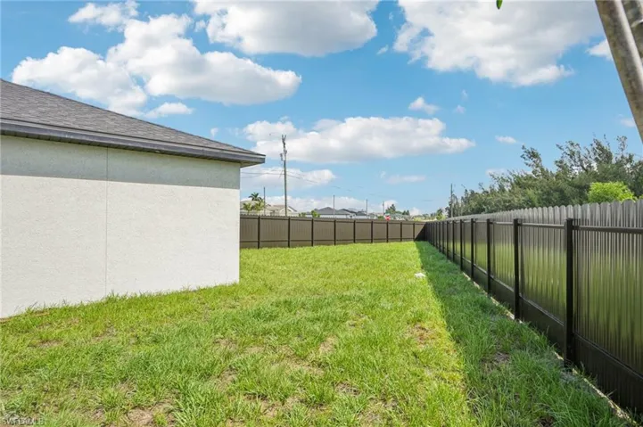View of fenced backyard