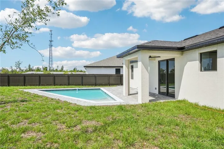 View of swimming pool featuring a patio area and a fenced backyard