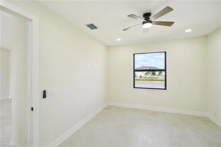 Unfurnished room featuring recessed lighting, light tile patterned flooring, and ceiling fan