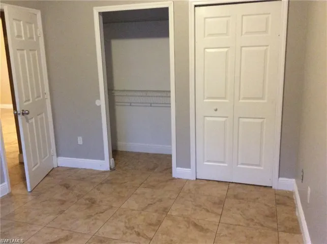 Neutral-toned walls complement the large format floor tiling