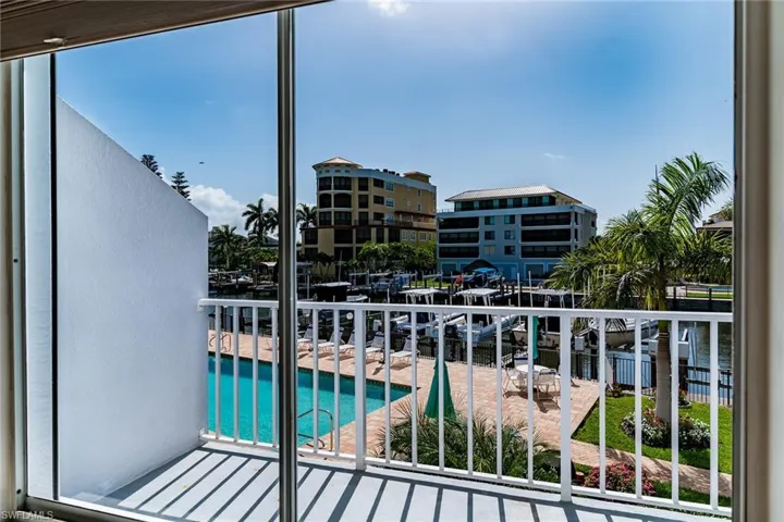 Balcony with view of pool area