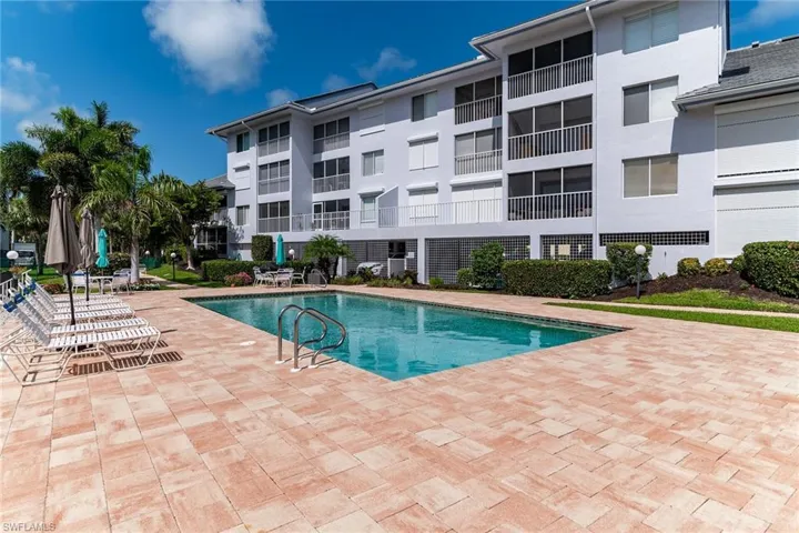 Community pool with a patio area