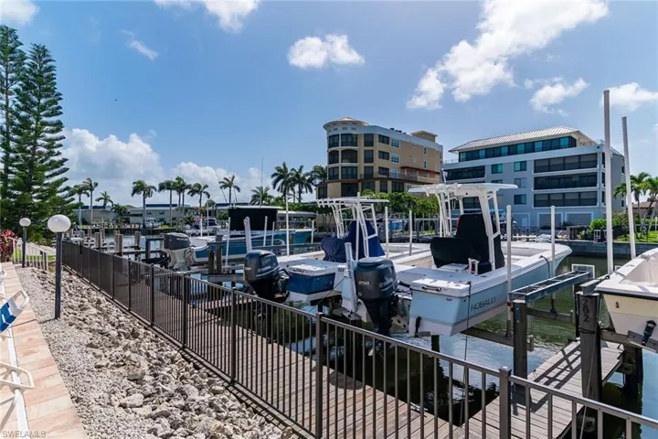 Dock with boat lift and a water view