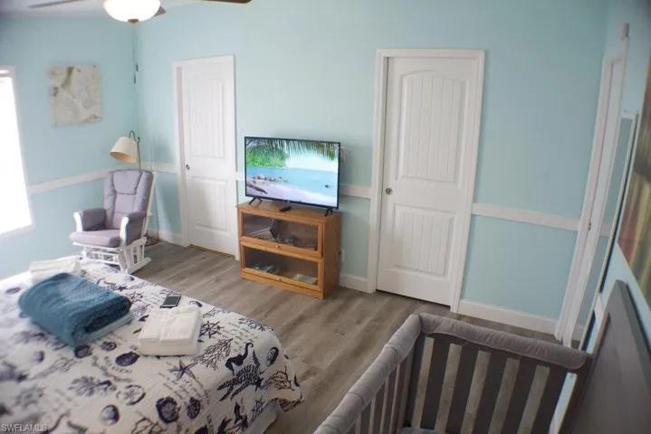 Bedroom with wood finished floors