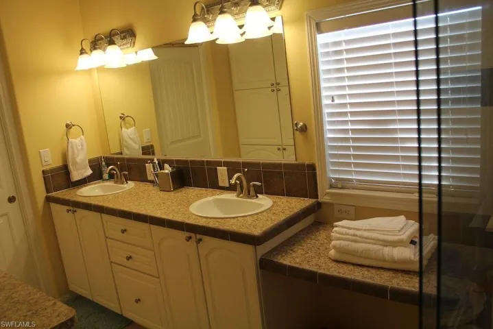 Bathroom featuring double vanity