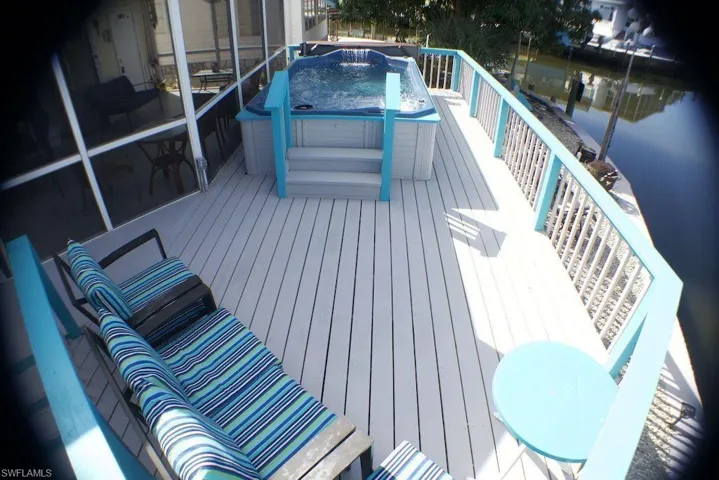 Wooden deck with a hot tub