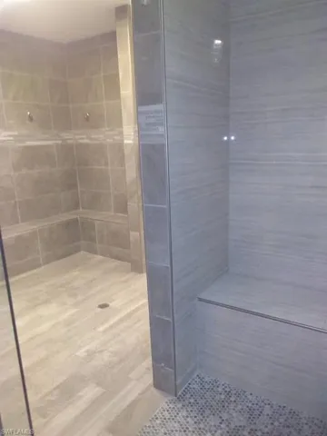 Full bathroom with tiled shower