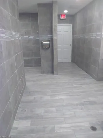 Bathroom featuring a tile shower