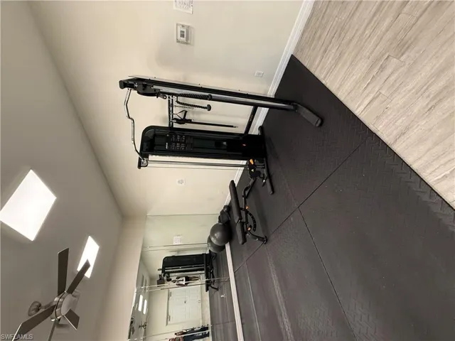 Gym featuring ceiling fan