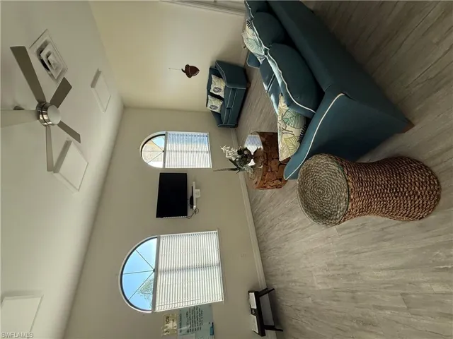 Sitting room featuring bookshelves