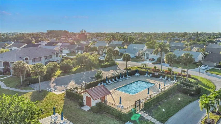 Aerial perspective of suburban area with a pool