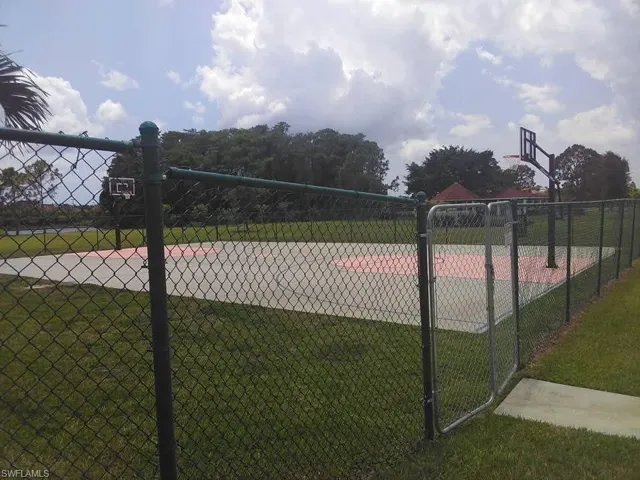 View of property's community with a yard and volleyball court