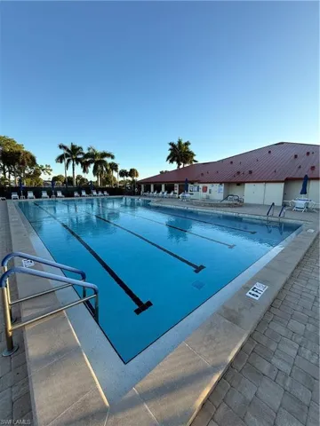 View of swimming pool with a hot tub, a pool, and a patio area