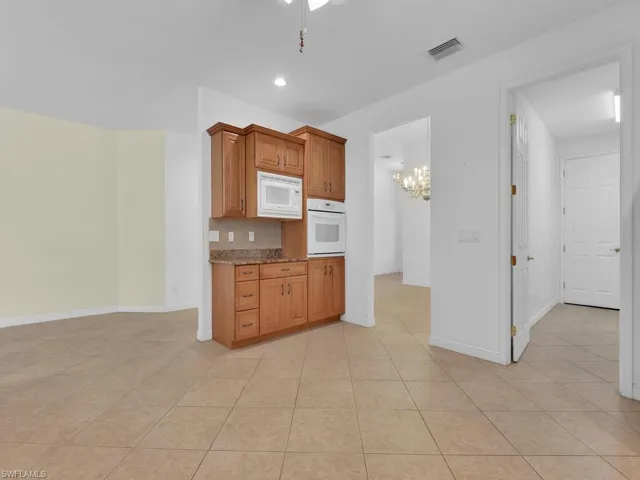 Enough Room For Auxiliary Island Or Dining Table