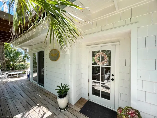 Doorway to property featuring a deck