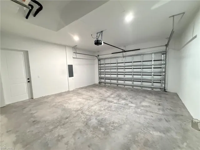 Garage featuring electric panel