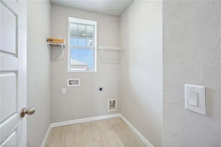 Washroom with washer hookup and electric dryer hookup
