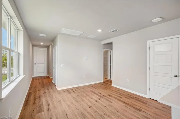 Spare room featuring light wood-type flooring