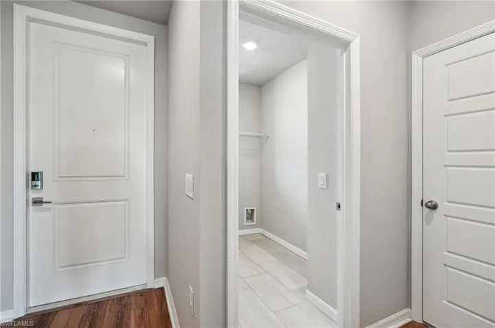 Corridor featuring light hardwood / wood-style flooring