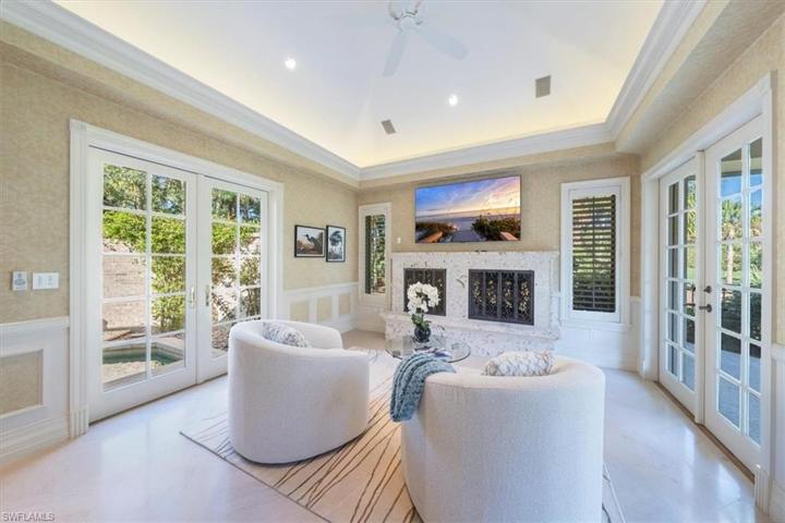 master sitting area with fireplace