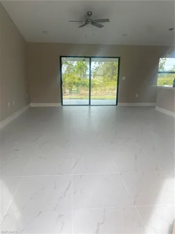 Spare room with ceiling fan