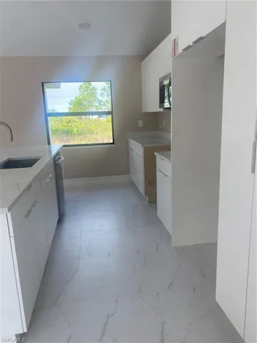 Laundry area featuring sink
