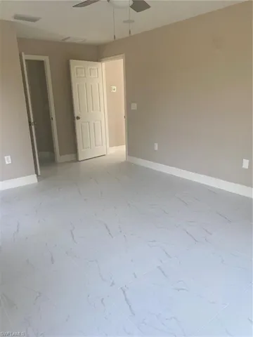 Unfurnished room with ceiling fan