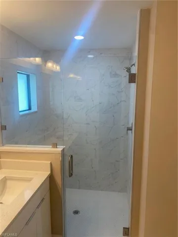 Bathroom with vanity and walk in shower