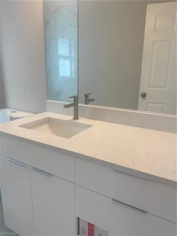 Bathroom with vanity and toilet