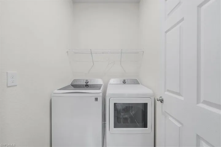 Laundry area featuring independent washer and dryer